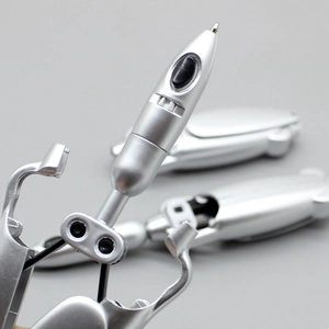 Creative silver metal frog-shaped folding ballpoint pen with mechanical transformation feature