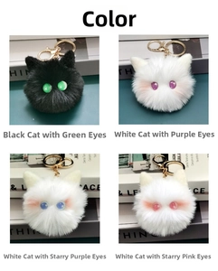 Close-up of four plush cat head keychains in black and white with colorful starry eyes