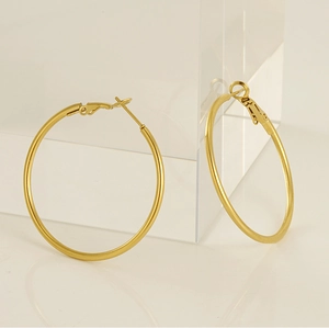 Close-up of classic 18K gold plated hoop earrings with secure latch back closure