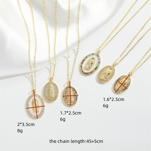 Gold plated vintage Virgin Mary necklace set with zircon and mother of pearl pendants