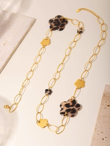 Detail of 18K gold-plated sweater chain with leopard print floral charms and lobster clasp
