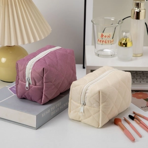 Quilted corduroy large capacity makeup bags in beige and pink with zipper closure