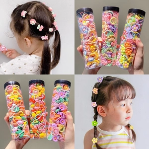 Colorful elastic hair bands and cute hair clips for girls in a clear cylinder package