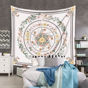 Bohemian floral tapestry detail featuring symmetrical sunflower design on a cozy bedroom wall