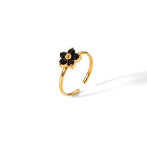Detailed view of a gold-finish open ring featuring a chic black five-petal flower accent