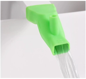 Macro view of green silicone faucet extender with smooth water flow for kids hand washing