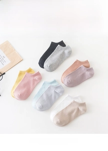 Close-up of colorful low-cut cotton socks set in various candy colors on white background