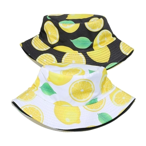 Women's summer bucket hats with lemon prints in black and white for sun protection