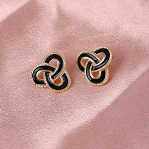 Vintage style black enamel earrings with gold beaded edges in a triple-loop design