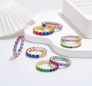 Detailed view of 925 silver eternity rings with 4mm colorful 5A zircon stones set in a row