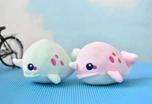 Adorable pair of soft plush narwhal keychains in mint green and pastel pink colors