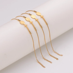 Set of 4 gold stainless steel bracelets with oval cross charms and religious medals