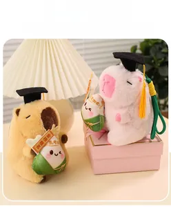 Close-up of plush graduation capybara toys with doctoral caps and cute accessories