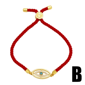 Verstellbares rotes geflochtenes Evil Eye Armband mit Goldakzenten und blauem Zirkonia