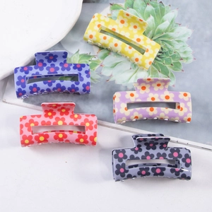 Five pieces of colorful floral square hair claws in yellow, blue, pink, purple, and grey