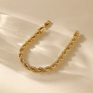 Detailed view of the 14K gold plated twist rope chain bracelet with lobster clasp closure