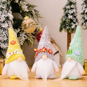Detailed view of three knitted Christmas gnomes with Hi patches and pearl decor