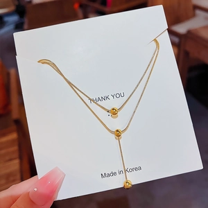 Elegant gold-plated double-layer snake chain necklace featuring polished beads