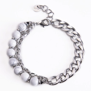 Close-up of double-layer stainless steel bracelet with white marble stone beads and lobster clasp