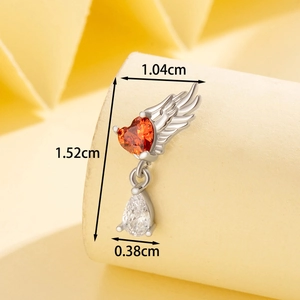 Silver angel wing belly ring with orange heart gem and clear pear-shaped stone pendant