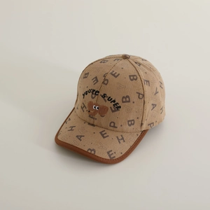 Detailed view of kids corduroy baseball cap featuring bear embroidery and letter print