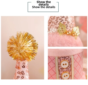 Close-up of pink sequined Christmas candy jar lid with faux fur and golden ornaments