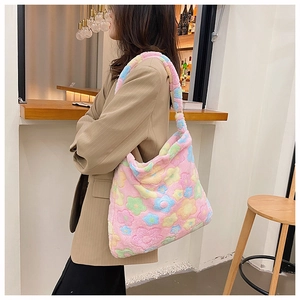 Side view of a soft plush floral tote bag shown on a model in a cafe setting