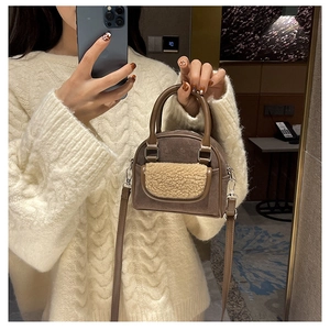 Detail of retro shell bag with brown suede texture and beige plush shearling flap