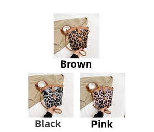 Three leopard print bucket bags in brown, black, and pink with metal turn-lock closures