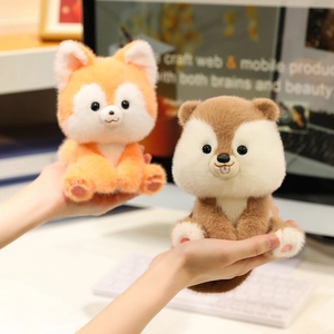 Cute plush fox and squirrel dolls held in hands with soft faux fur and embroidered details