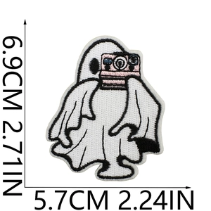 Ghost embroidery patch with pink camera showing dimensions 5.7cm x 6.9cm on white background
