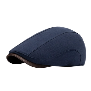 British retro flat cap in navy fabric and brown leather brim for men and women