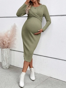 Detail of cross-front neckline on long-sleeved olive green maternity knit midi dress