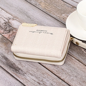 Close-up of beige PU leather wallet with Forever Sunshine text and golden zipper detail