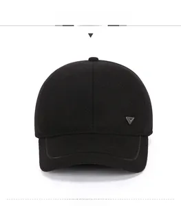 Front view of black wool baseball cap featuring a silver triangle metal logo on the side