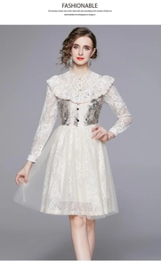 Detail of floral embroidery and ruffled collar on ivory lace tulle dress