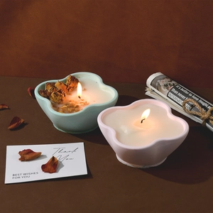 Macro detail of flower petal candle cups with dried rosebuds in a warm home setting
