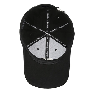 Internal view of black baseball cap showing sweatband, lining and adjustable buckle strap