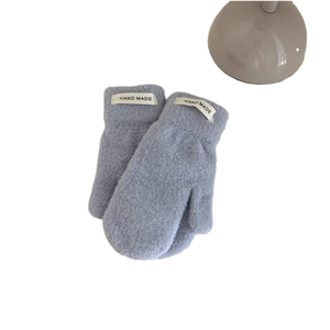 Plush light blue faux mink fur mittens for women with handmade label on white background