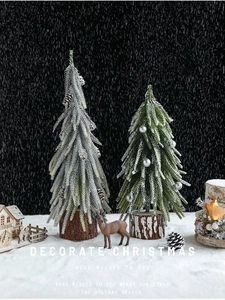 Mini Christmas trees with snow flocking, pine cones, and wood base for table decor