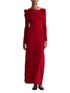 Close-up of elegant 3D floral decorations on the off-shoulder neckline of a red knitted dress
