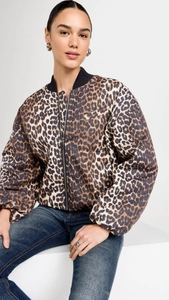 Close-up of trendy leopard print jacket featuring black ribbed knit collar and zipper details