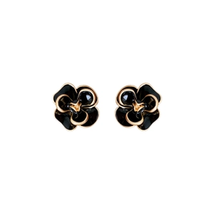 Vintage camellia flower stud earrings in black enamel and gold finish on white backdrop
