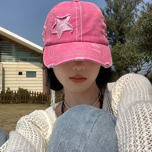 Pink vintage distressed baseball cap with sequin star patch and frayed denim brim