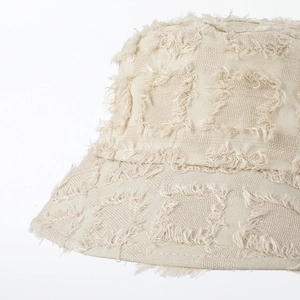 Beige bucket hat with frayed edges and plaid texture for women in casual fashion