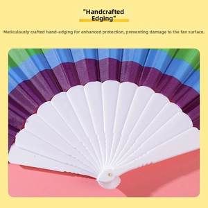 Detailed view of hand-wrapped edges on rainbow folding fan with white plastic ribs
