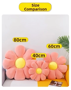 Size comparison of daisy pillows in 40cm, 60cm and 80cm diameters on a sofa