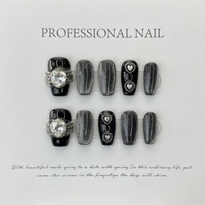 Handmade dark cat eye press-on nails with black finish and 3D silver heart rhinestones