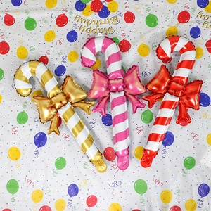 Three colorful candy cane foil balloons with bows for Christmas and party decoration