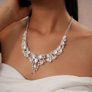 Detail view of luxury silver-tone statement necklace with cascading water-drop crystals